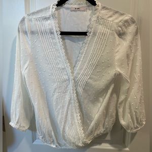 Francesca’s small white blouse